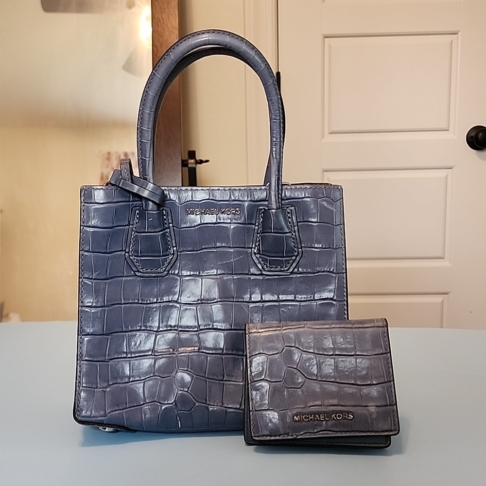 Well‎ loved blue Michael Kors handbag and matching wallet